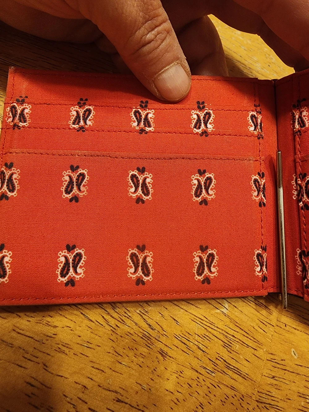 Saint Laurent wallet features a distinctive paisley bandana print on interior